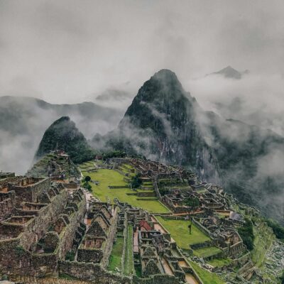 Breathtaking image of Machu Picchu shrouded in mist, showcasing iconic Inca ruins.